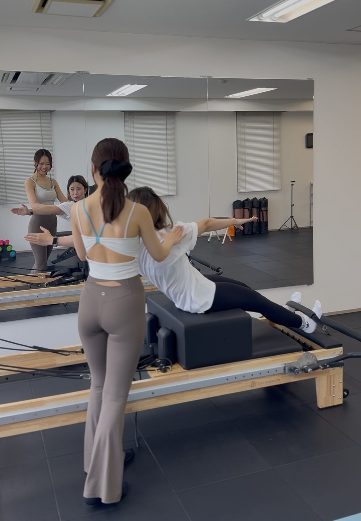 Trainer explaining reformer set-up